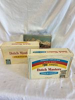 Three Dutch Masters cigar boxes front view