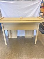 Front view of cream distressed solid wood storage bench