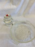 Cupcake crystal trinket box beside pressed glass dish