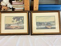 Pair of framed hunting prints side by side