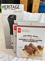 Boxed Heritage sous-vide cooker and two President's Choice rib rack boxes