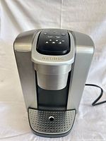 Front view of Keurig K-Elite coffee maker showing overall condition