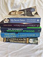 Stack of all five books showing titles and spines