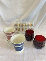 Group view showing all seven pieces: 3 highballs, 2 mugs, 2 cranberry tumblers