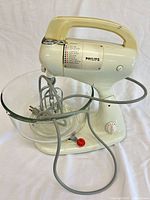 Full view of Philips stand mixer with glass bowl and beaters attached