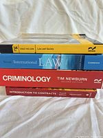 Stack showing spines of all four textbooks