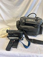 Camcorder, Ambico bag, remote, battery and manual grouped