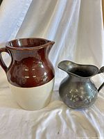 Both pitchers side by side on white backdrop