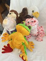 Group shot of five Webkinz plush animals