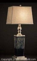 Front view of lamp base with shade lit