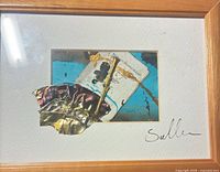 Rectangular collage with blue background in wood frame
