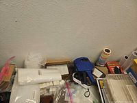 Overall lot showing blue labelers, label rolls, accessories