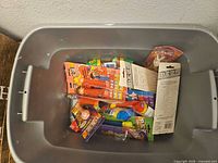 Storage bin showing multiple sealed Teenage Mutant Ninja Turtles PEZ dispensers