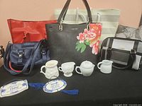 Group shot of all handbags, milk glass pieces, plaques