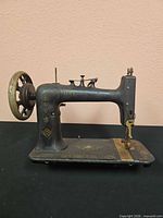 Full view of sewing machine head showing overall form and condition