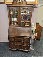 Front view of closed secretary desk showing overall form and finish