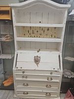 Full front view showing entire secretary desk, hutch, drawers, paint wear