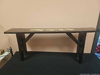 full view of wooden bench showing structure and finish