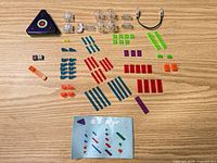 All pieces laid out including power base, LED modules, bricks, cable, tool, booklet