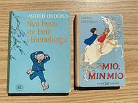 Front covers of both books showing titles, author, cover art, wear to edges