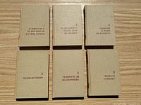 Front covers of all six volumes laid out