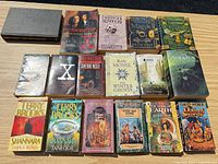 All 17 books laid out in three rows