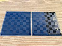 Two Pavilion Limited smoked glass boards side by side on wood surface