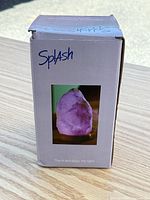 Front of Splash branded box showing image of illuminated salt lamp