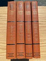 Spines of all four volumes showing titles and publisher