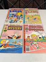 Four vintage comics bagged/boarded
