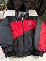 Front view of red and black Chicago Bulls hooded jacket