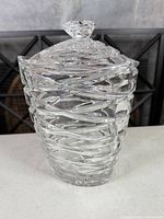 Full view of crystal lidded jar, showing spiral cuts
