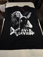 Front of black Avril Lavigne graphic T-shirt laid flat