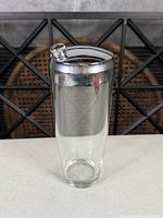 Full view of glass shaker with chrome lid