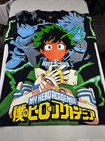 Front view of black T-shirt with My Hero Academia full-front graphic
