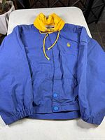 Front view of Nautica windbreaker showing color, logo, and closures