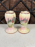 Front view of both Nippon bud vases showing hand-painted landscape and colors