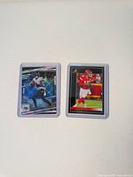 Fronts of both cards in top loaders