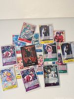 Full spread of all 12 sleeved One Piece cards
