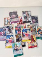 All 15 sleeved foil One Piece cards laid out
