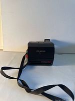 Front view of Polaroid Autofocus 660 showing branding and lens door closed