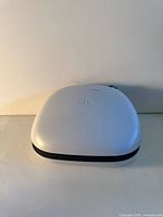 Top view of closed white hard shell case with PS logo