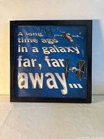 Front view of framed Star Wars typographic wall art print