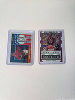 Front view of both cards displaying artwork and surface condition