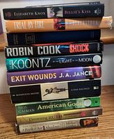 Stack view of all ten books showing titles and formats