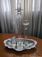 Three glass pieces on hammered aluminum tray, showing overall lot