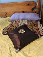 All three pillows on bed showing styles and sizes