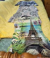 Three patterned short-sleeve tops laid out on bed