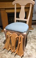 Chair and three plate holders front view
