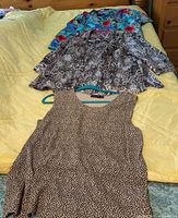 Three tops laid out showing prints and styles